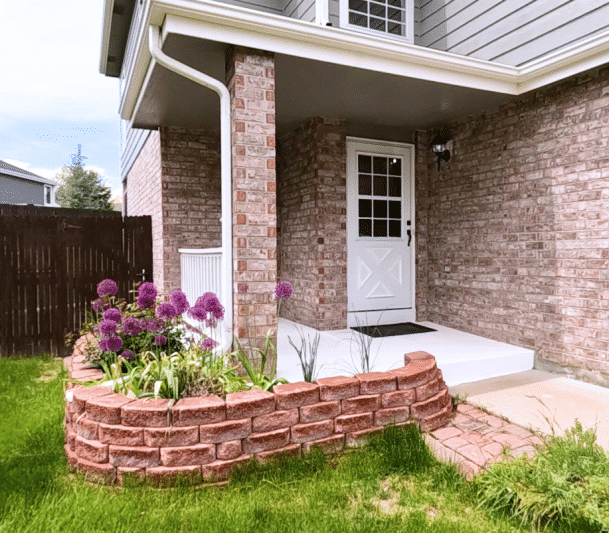 Block retaining wall with front porch