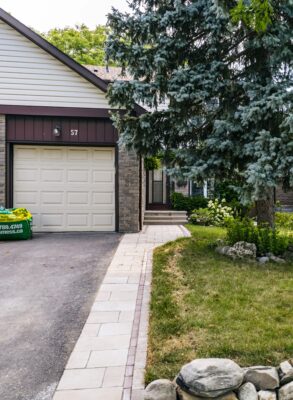 Interlocking walkway with natural stone wall
