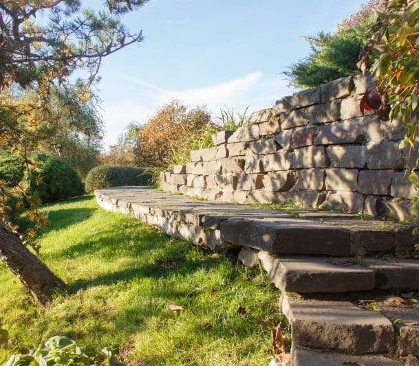 Armour stone retaining wall in the yard